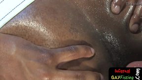 Interracial hunks enjoy extreme fisting