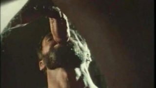 Bearded bottom in retro gay video