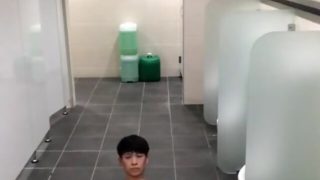 Oriental young jack in public toilet